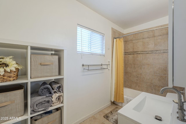 bathroom with shower / tub combo, sink, and tile patterned flooring