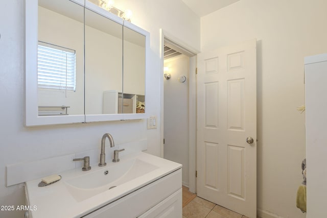 bathroom featuring vanity and tile patterned flooring