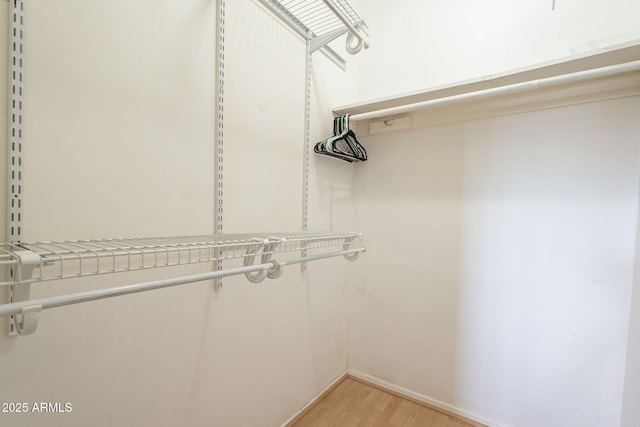 walk in closet featuring light wood-type flooring