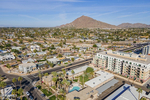 birds eye view of property with a mountain view