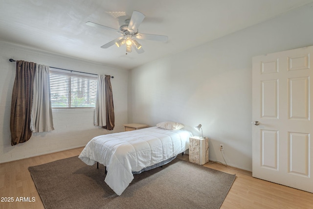 bedroom featuring ceiling fan and light wood-type flooring