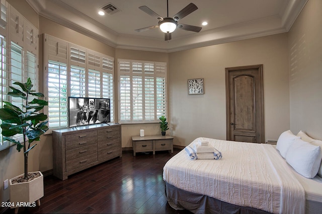 bedroom with ceiling fan, dark wood-type flooring, and ornamental molding