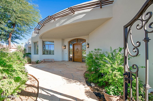 doorway to property featuring a patio area