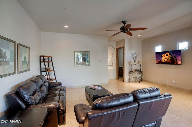 living room with ceiling fan and light tile patterned floors