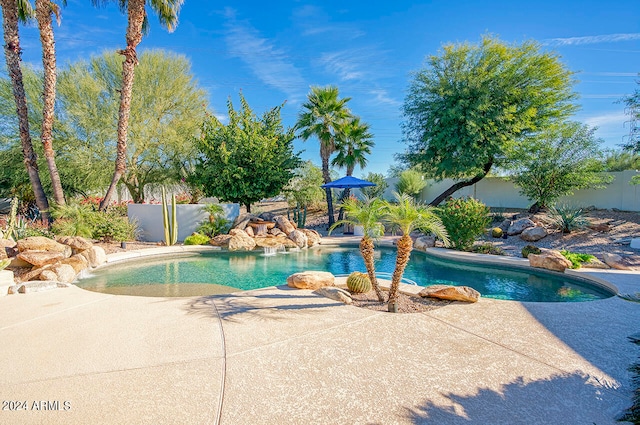 view of swimming pool with a patio area