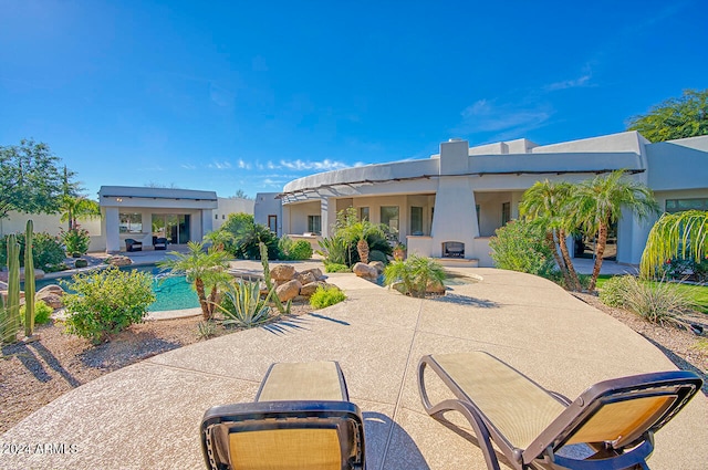 rear view of property with a patio area