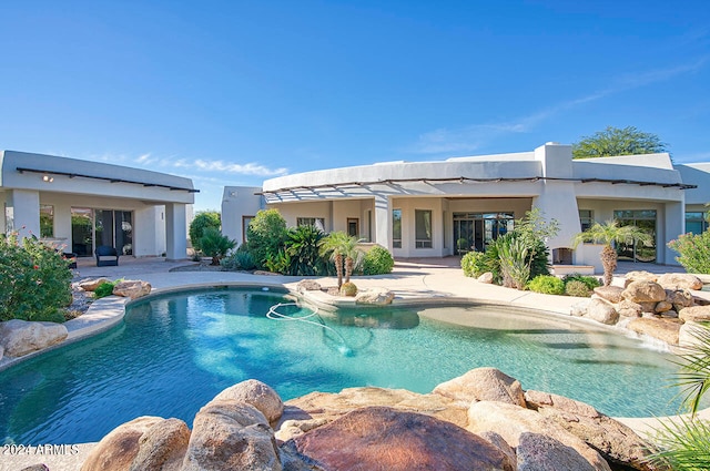 view of swimming pool with a patio