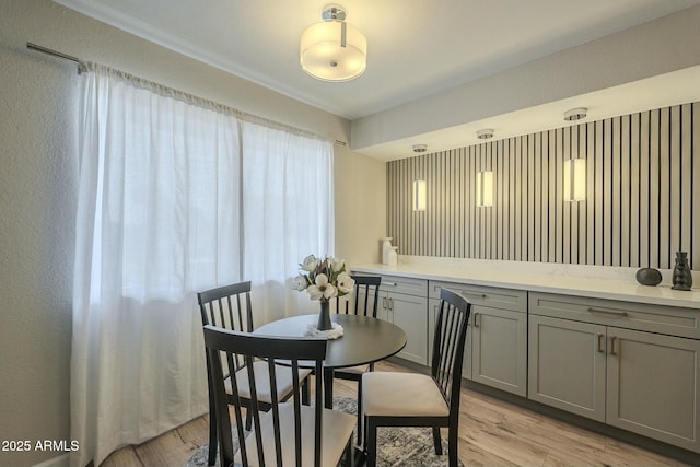 dining area with light wood finished floors