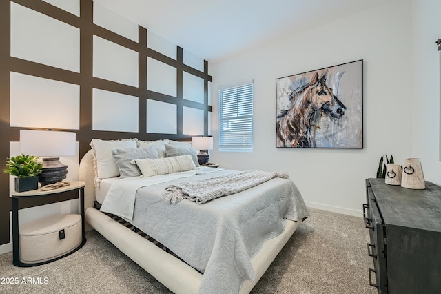 bedroom featuring carpet floors and baseboards