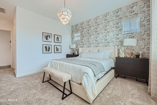 bedroom with light carpet, multiple windows, visible vents, and baseboards