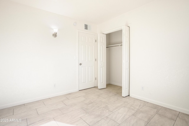 unfurnished bedroom featuring a closet