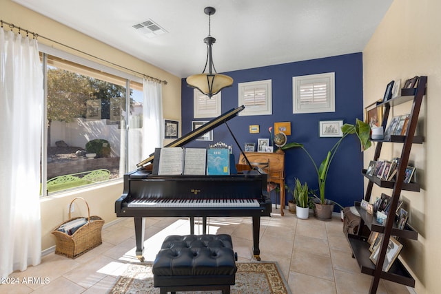 miscellaneous room with light tile patterned floors