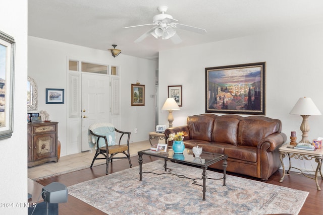 living room with ceiling fan and hardwood / wood-style floors