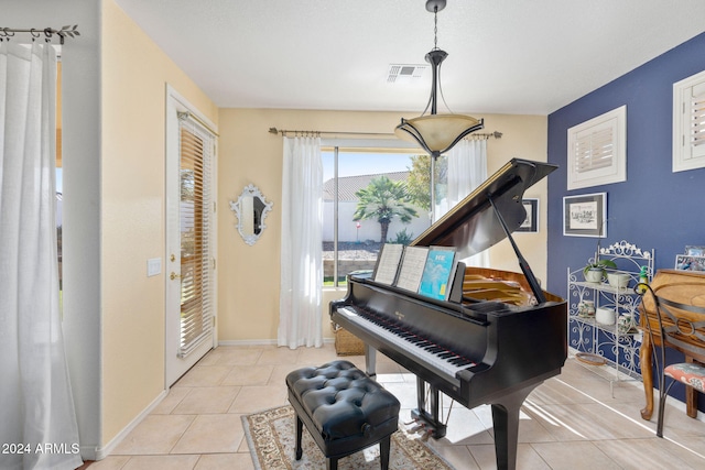 misc room with light tile patterned floors