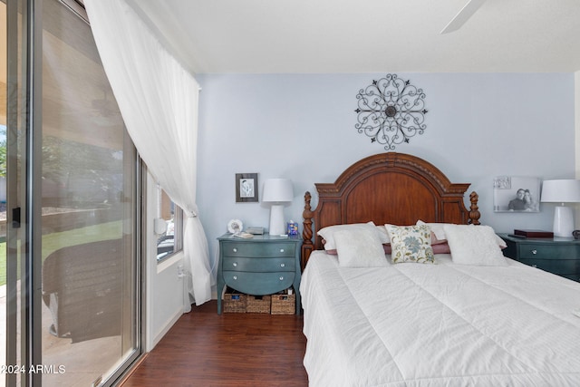 bedroom featuring access to outside, ceiling fan, and dark hardwood / wood-style flooring