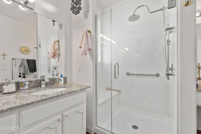 bathroom featuring vanity and walk in shower