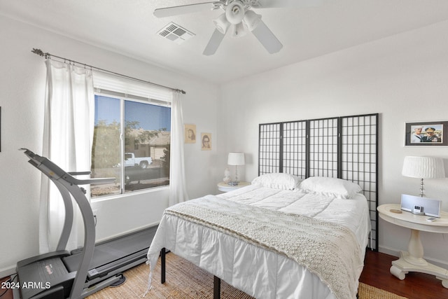 bedroom featuring ceiling fan and hardwood / wood-style flooring