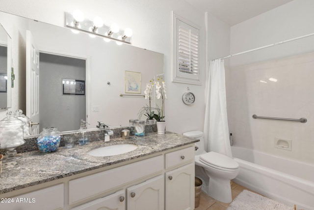 full bathroom with vanity, shower / tub combo with curtain, toilet, and tile patterned floors