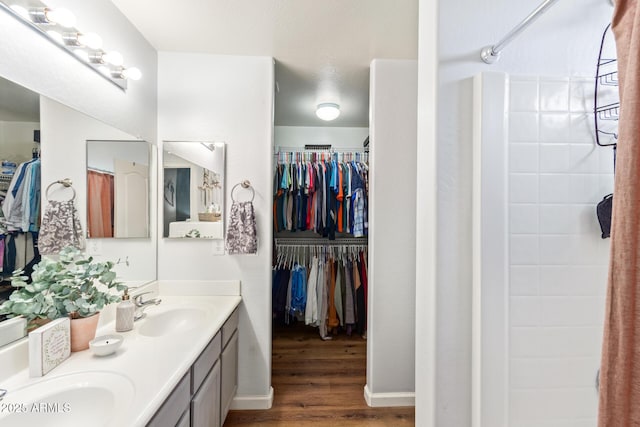 bathroom with vanity and hardwood / wood-style floors