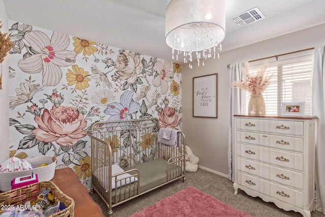 bedroom featuring carpet and a chandelier