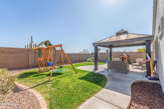 view of yard featuring a gazebo, an outdoor living space, a playground, and a patio