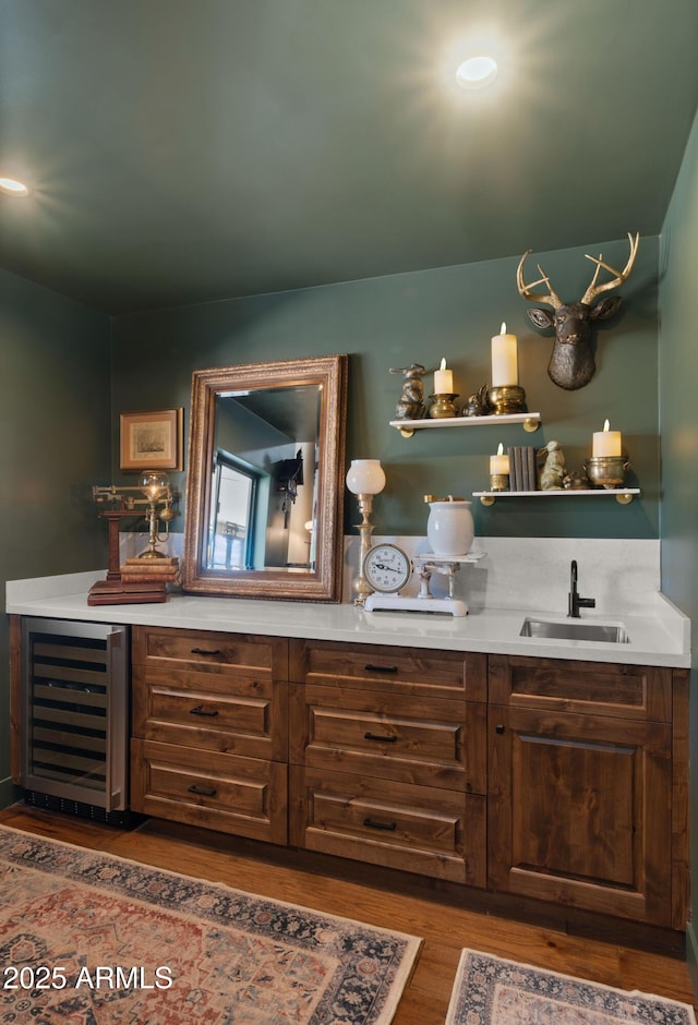 8049 E Serene St, Carefree, AZ 85377 - indoor wet bar featuring wine cooler and wood finished floors