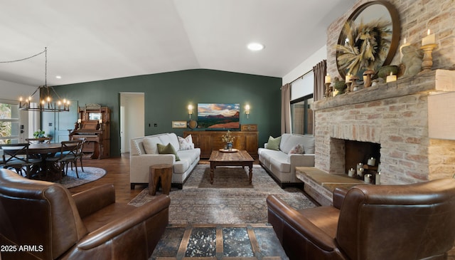 8049 E Serene St, Carefree, AZ 85377 - living area with vaulted ceiling, a chandelier, wood finished floors, a fireplace, and recessed lighting