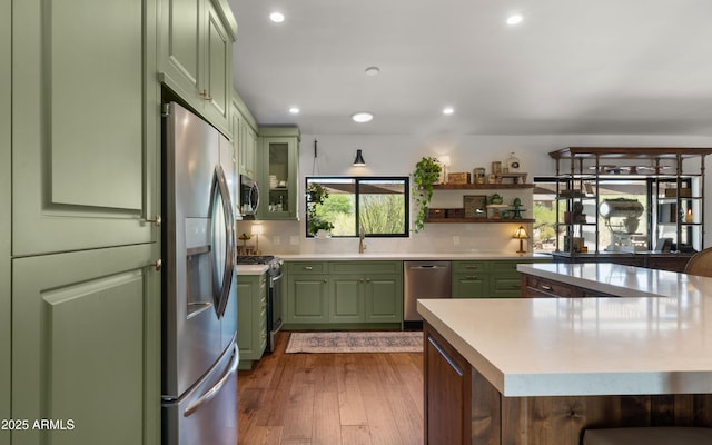 8049 E Serene St, Carefree, AZ 85377 - kitchen with green cabinetry, stainless steel appliances, light countertops, recessed lighting, and open shelves