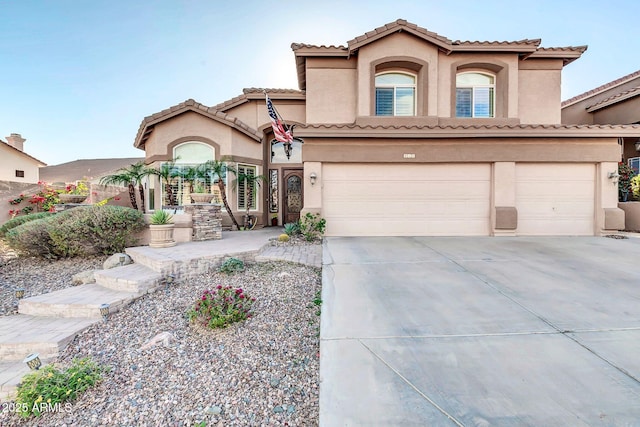 mediterranean / spanish-style house featuring a garage