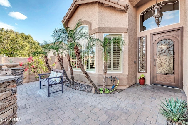 doorway to property with a patio