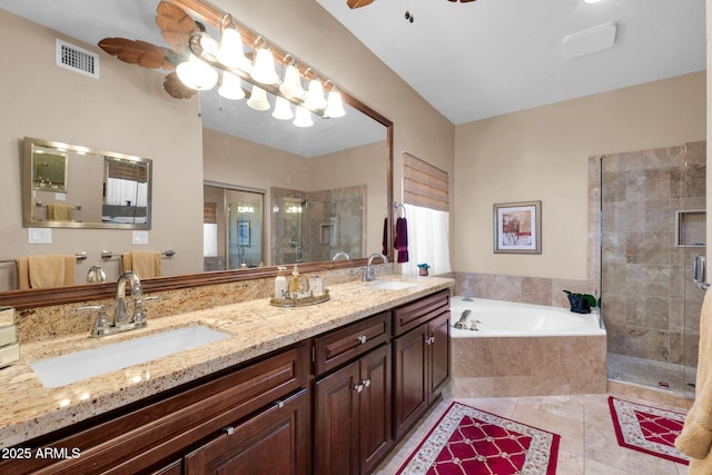 bathroom with tile patterned flooring, vanity, ceiling fan, and shower with separate bathtub