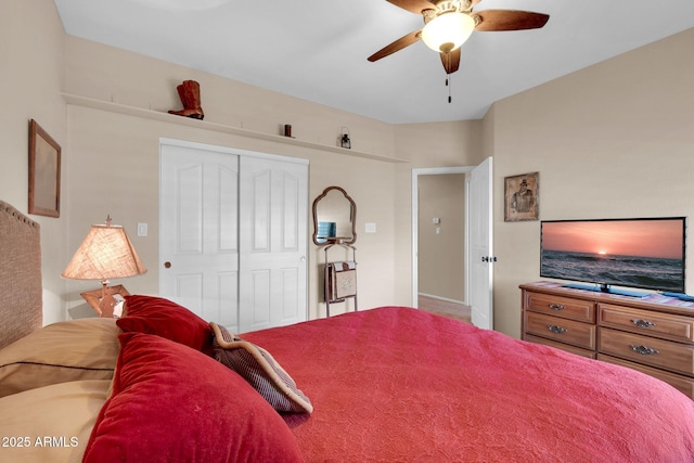 bedroom with ceiling fan and a closet