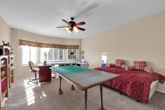 game room featuring light carpet and ceiling fan