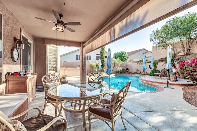 view of pool featuring ceiling fan and a patio