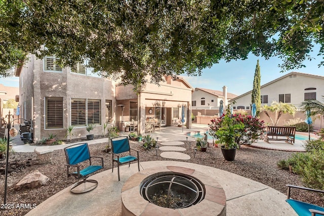 view of patio featuring a fire pit