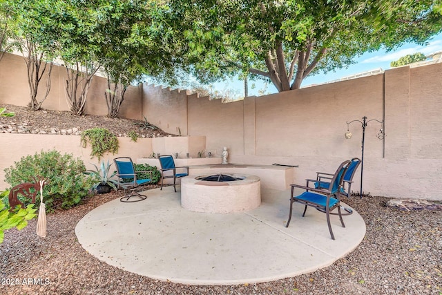 view of patio with a fire pit