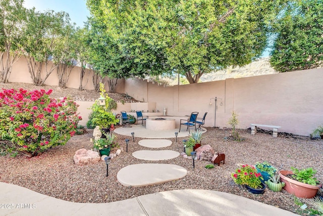 view of yard featuring a patio and an outdoor fire pit