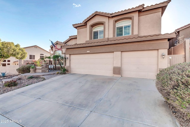 mediterranean / spanish-style house featuring a garage