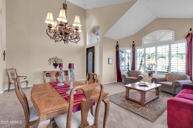 dining area with light carpet, a towering ceiling, and a notable chandelier