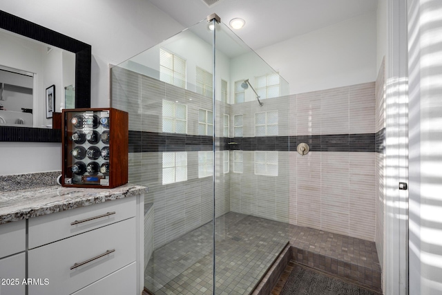 full bathroom with walk in shower and vanity