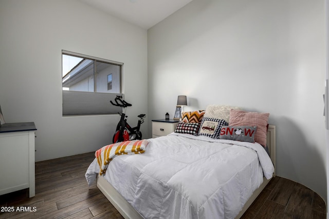 bedroom with wood finished floors