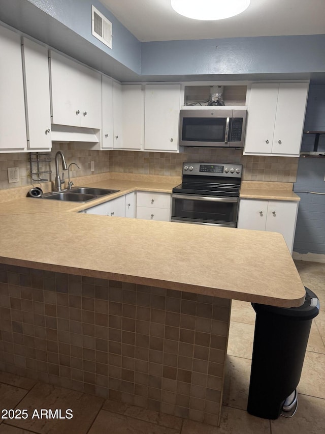 5363 N Black Canyon Highway, Phoenix, AZ 85015 - kitchen with a sink, visible vents, light countertops, and appliances with stainless steel finishes