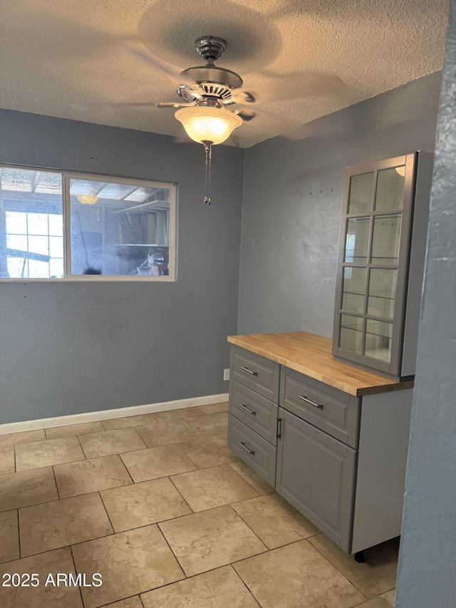5363 N Black Canyon Highway, Phoenix, AZ 85015 - unfurnished room with baseboards, a ceiling fan, and a textured ceiling