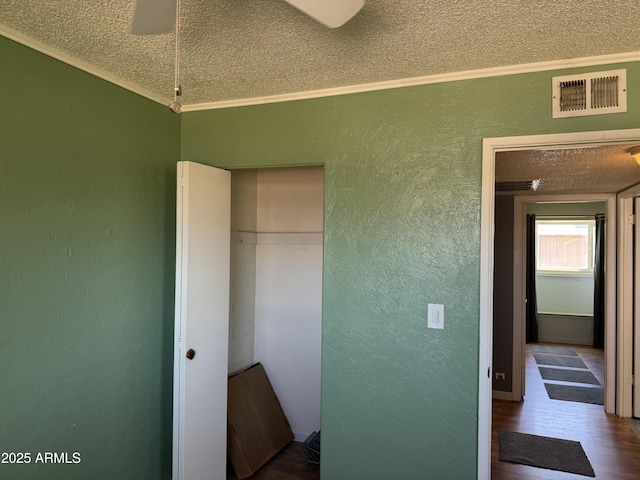 5363 N Black Canyon Highway, Phoenix, AZ 85015 - unfurnished bedroom with visible vents, a closet, ornamental molding, a textured wall, and a textured ceiling