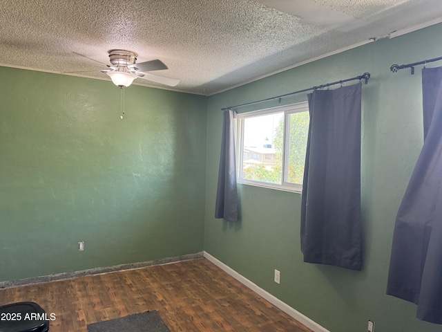 5363 N Black Canyon Highway, Phoenix, AZ 85015 - spare room with baseboards, dark wood-style flooring, a textured ceiling, and a ceiling fan