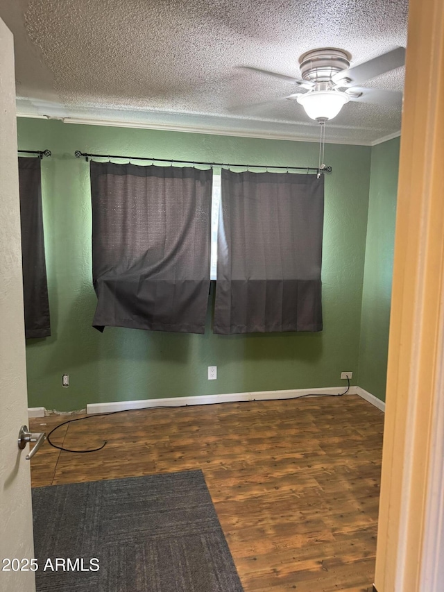 5363 N Black Canyon Highway, Phoenix, AZ 85015 - unfurnished room featuring baseboards, ceiling fan, a textured ceiling, crown molding, and wood finished floors