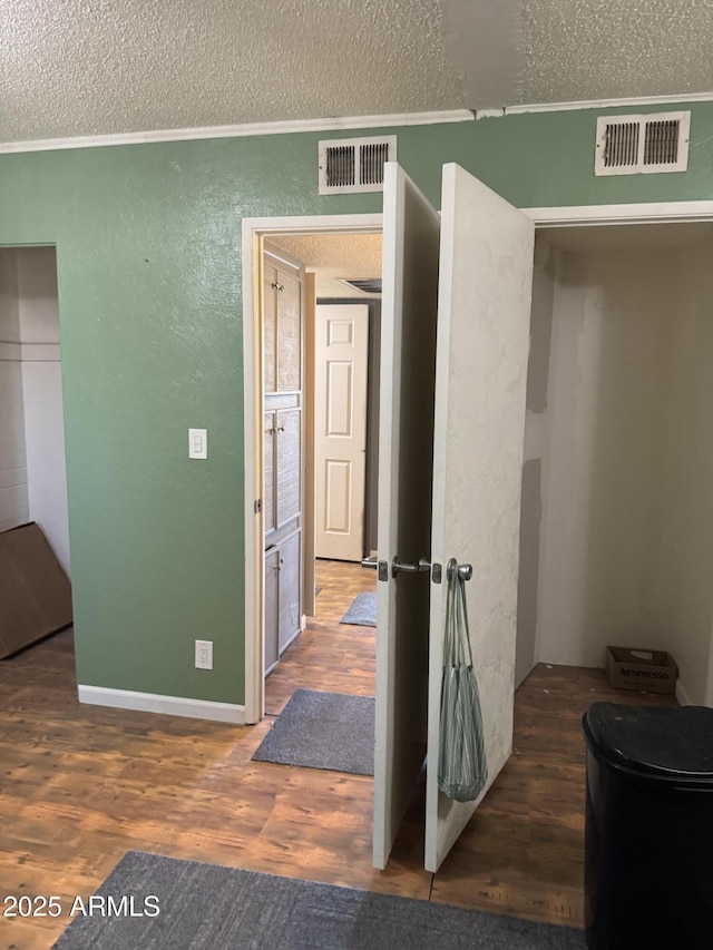 5363 N Black Canyon Highway, Phoenix, AZ 85015 - bedroom with visible vents, a textured wall, wood finished floors, and a textured ceiling