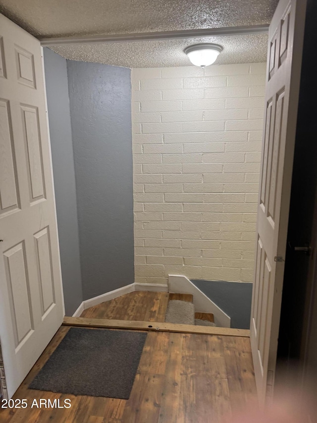 5363 N Black Canyon Highway, Phoenix, AZ 85015 - bathroom with a textured ceiling, baseboards, and wood finished floors