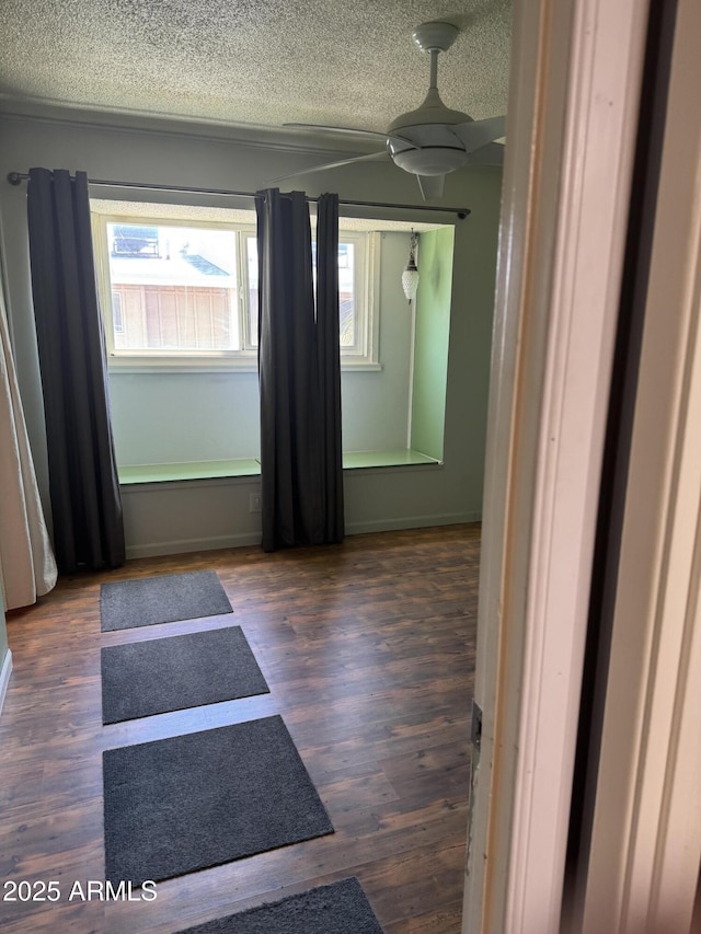 5363 N Black Canyon Highway, Phoenix, AZ 85015 - spare room featuring baseboards, a ceiling fan, wood finished floors, and a textured ceiling