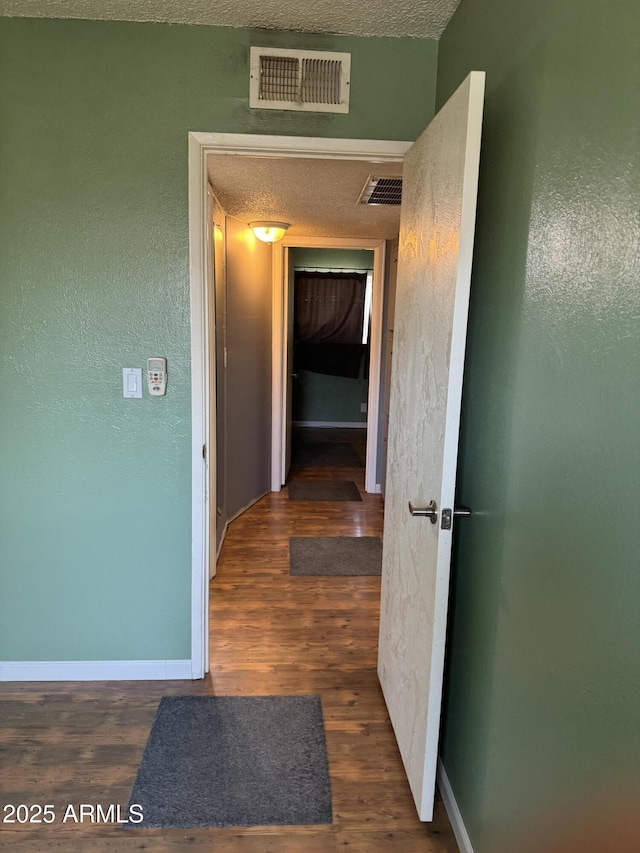 5363 N Black Canyon Highway, Phoenix, AZ 85015 - hall with wood finished floors, baseboards, and visible vents